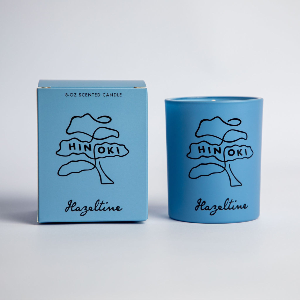 hinoki scented candle in blue jar with box