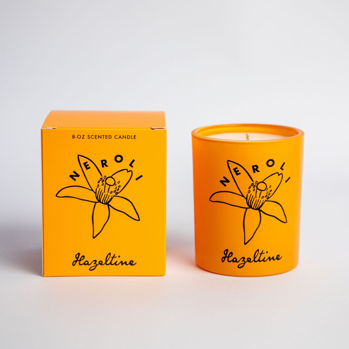 neroli scented candle in yellow jar with box
