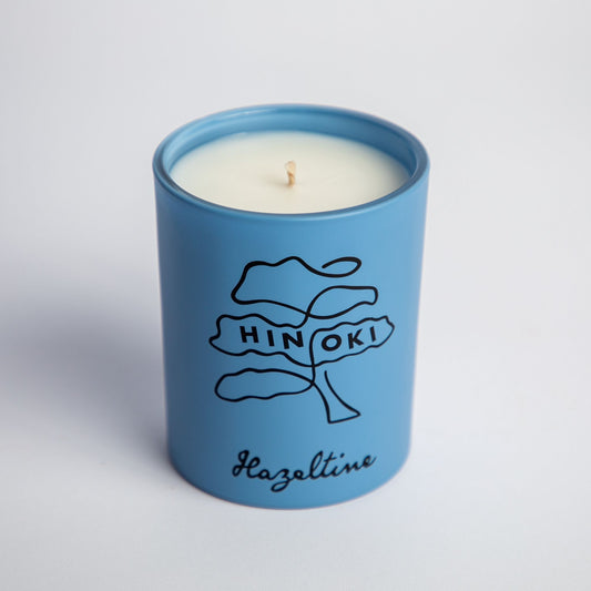 hinoki scented candle in blue jar