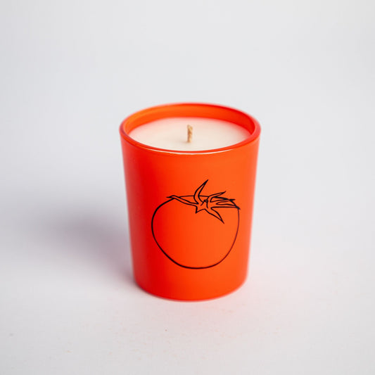 tomato scented candle in small red jar