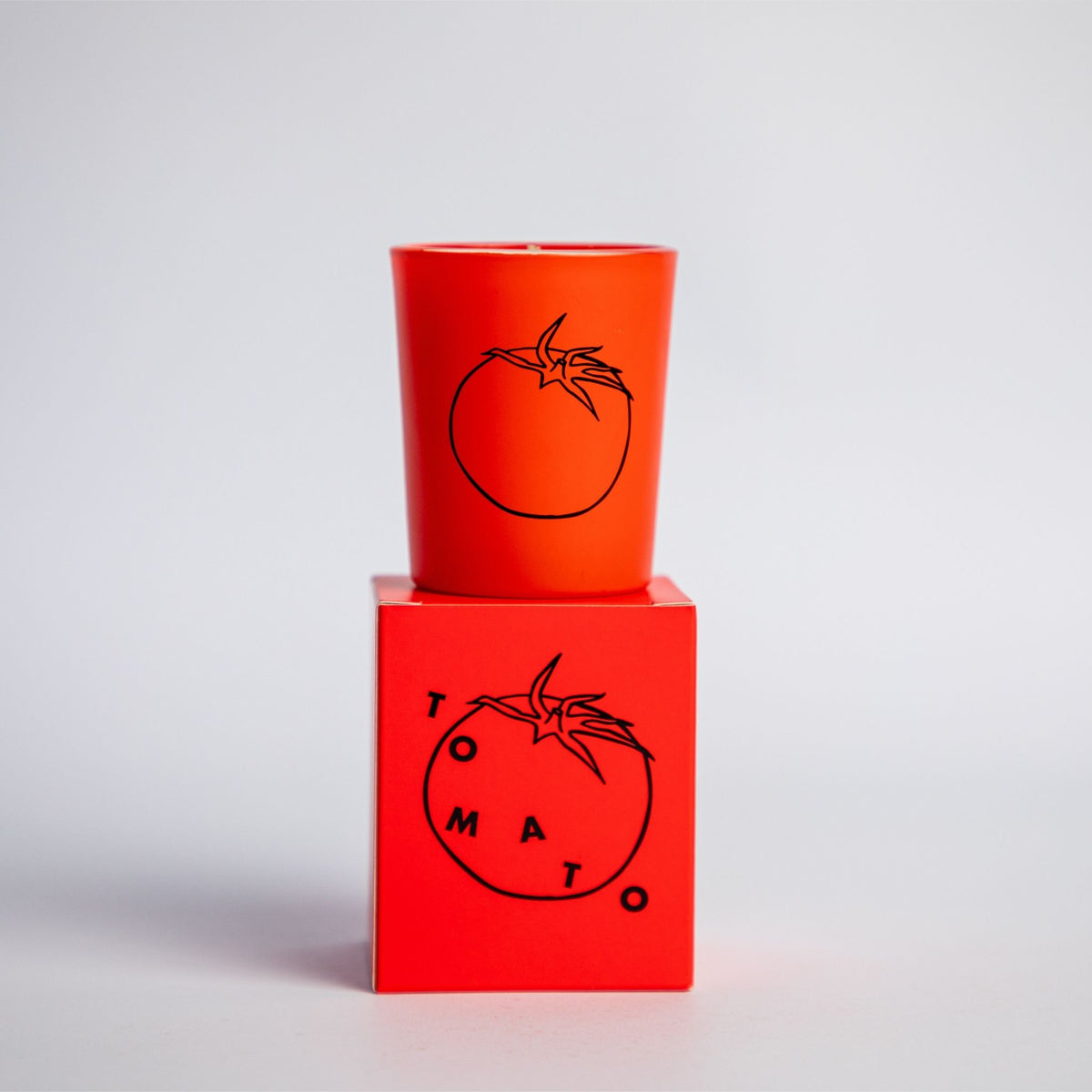 tomato scented candle in small red jar with box